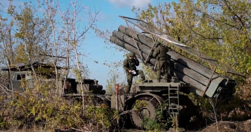 In this photo taken from a video released by Russian Defense Ministry press service on Monday, Nov. 25, 2024, Russian servicemen operate a Russian Uragan self-propelled multiple rocket launcher in an undisclosed location. (Russian Defense Ministry Press Service via AP)