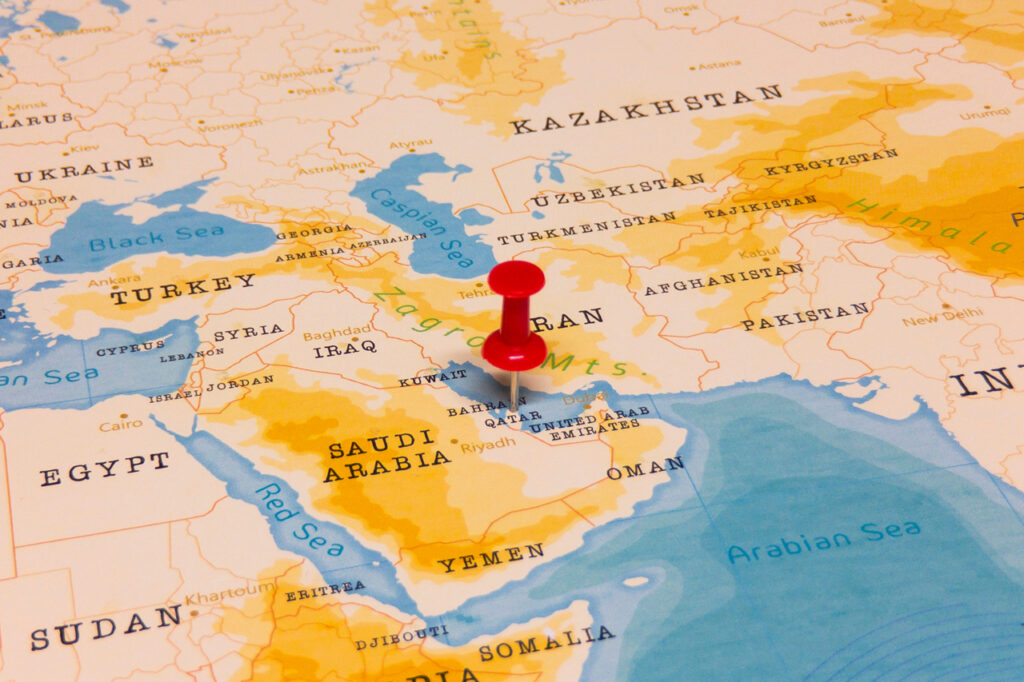 A Red Pin on Qatar of the World Map (Shutterstock)