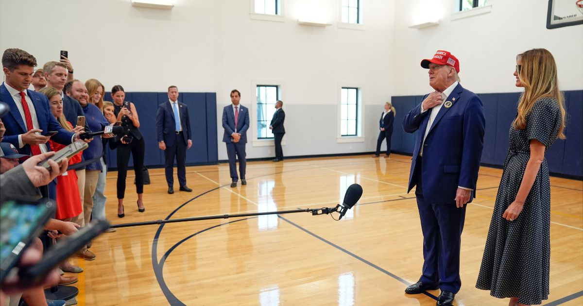 Republican presidential nominee former President Donald Trump speaks as former first lady Melania Trump listens after they voted on Election Day at the Morton and Barbara Mandel Recreation Center, Tuesday, Nov. 5, 2024, in Palm Beach, Fla. (AP Photo/Evan Vucci)