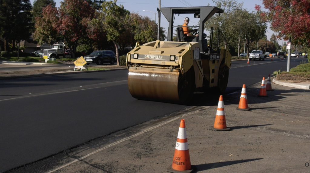 Image of a yellow paving roller
