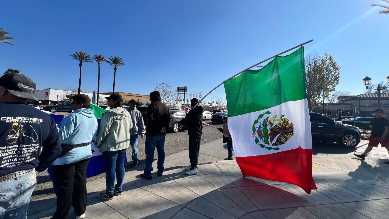 A photo of a man holding the Mexico flag. (Anthony W. Haddad)