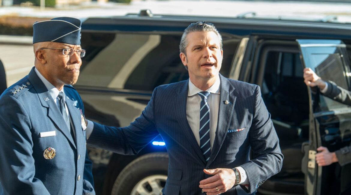 Defense Secretary Pete Hegseth, right, pats Chairman of the Joint Chiefs of Staff Gen. Charles Q. Brown Jr., on his shoulder as he answers questions from reporters after arriving at the Pentagon, Monday, Jan. 27, 2025 in Washington. (AP/Kevin Wolf)