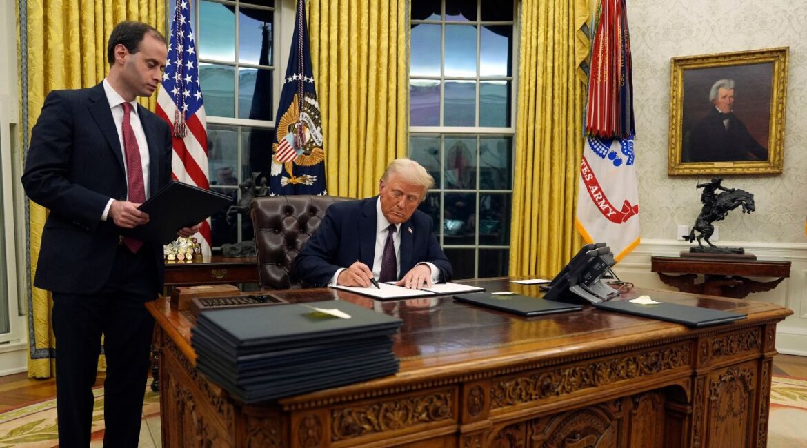 President Donald Trump signs an executive order withdrawing the U.S. from the World Health Organization in the Oval Office of the White House, Monday, Jan. 20, 2025, in Washington. (AP/Evan Vucci)