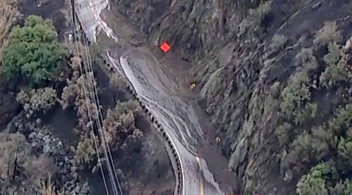 This aerial image provided by KABC-TV shows a mud-covered road, Monday, Jan. 27, 2025 in Topanga, Calif. (KABC-TV via AP)
