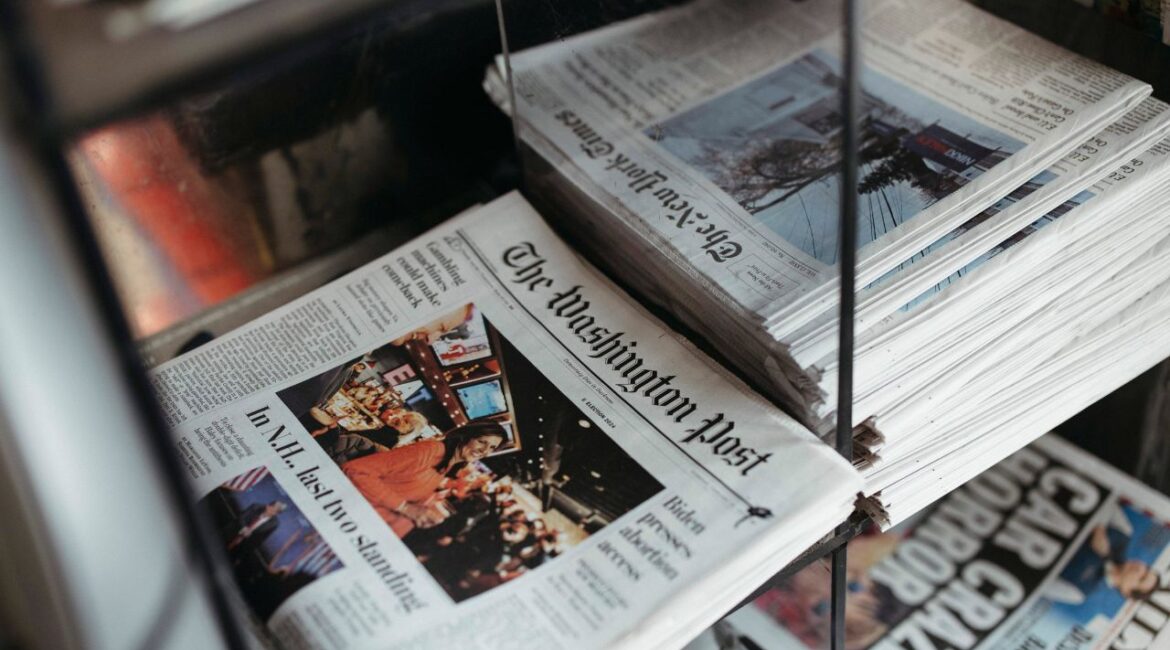 Copies of the Washington Post on a newspaper stands in New York on Jan. 23, 2024. The Washington Post’s owner, Jeff Bezos, announced a narrowing of the opinion section’s focus to defend “personal liberties and free markets,” along with word that the paper’s opinions editor, David Shipley, was resigning. (Ahmed Gaber/The New York Times)