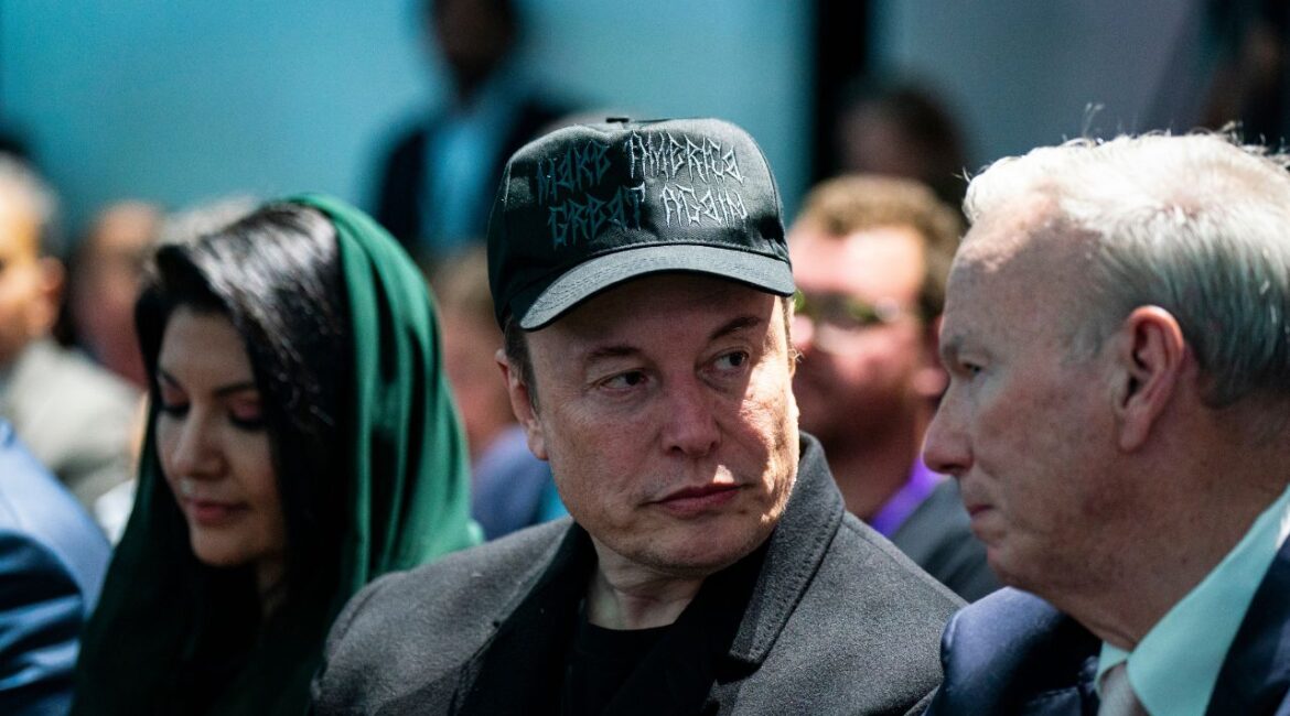Elon Musk speaks with Eric Schmidt, the former chief executive of Google, before a speech by President Donald Trump in Miami Beach, Fla., Feb. 19, 2025. More than 230,000 Canadians have signed a petition to revoke Elon Musk’s Canadian citizenship and passport over what the petition calls his attempts to engage in practices that go against Canada’s national interest. (Al Drago/The New York Times)