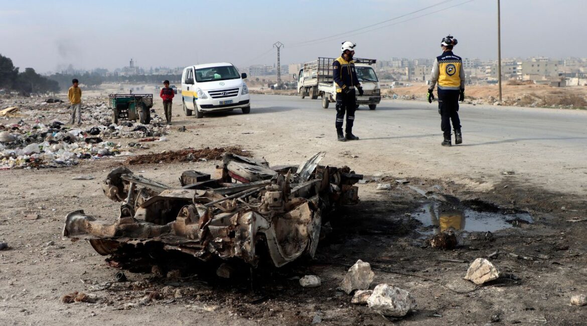 In this photo provided by the Syrian Civil Defense White Helmets, which has been authenticated based on its contents and other AP reporting, Syrian White Helmet civil defense workers inspect the area of a car bomb attack that killed least 15 people and wounded dozens, the local Syrian civil defense reported, on the outskirts of the city of Manbij, Syria, Monday. Feb. 3, 2025. (Syrian Civil Defense White Helmets via AP)