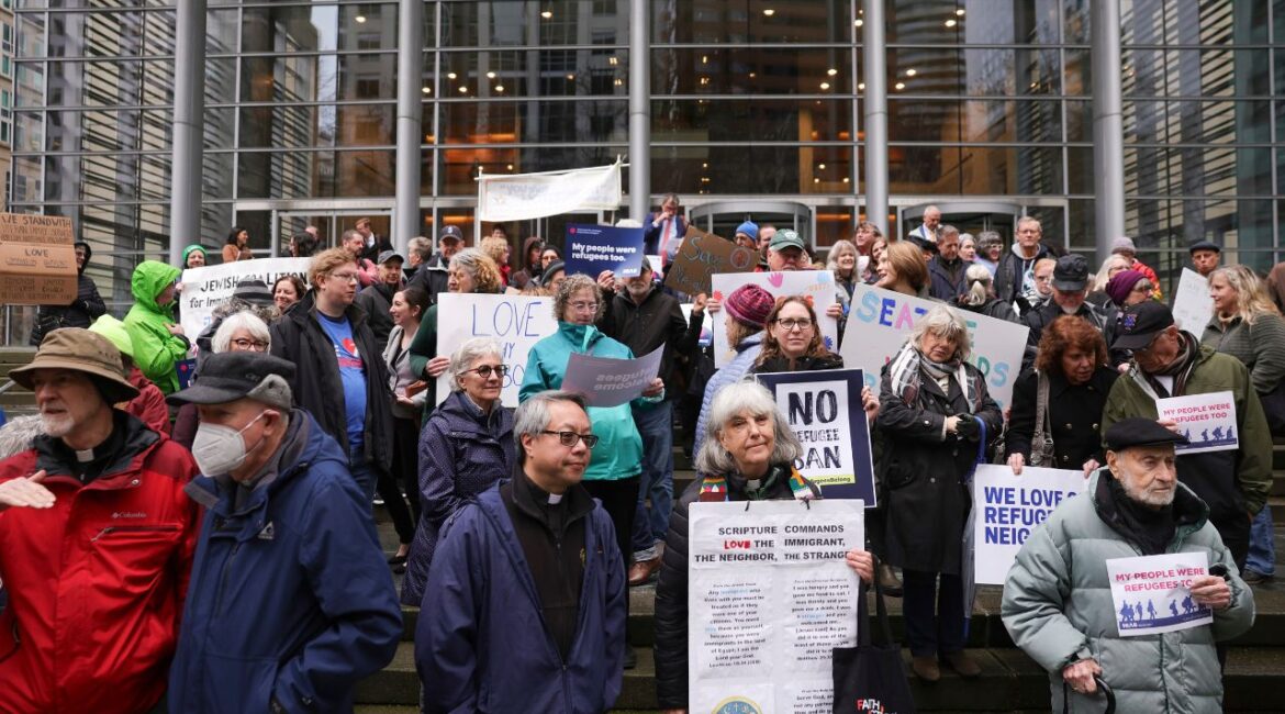 People gather outside the U.S. District Court after a federal judge blocked President Donald Trump's effort to halt the nation's refugee admissions system Tuesday, Feb. 25, 2025, in Seattle. (AP/Ryan Sun)