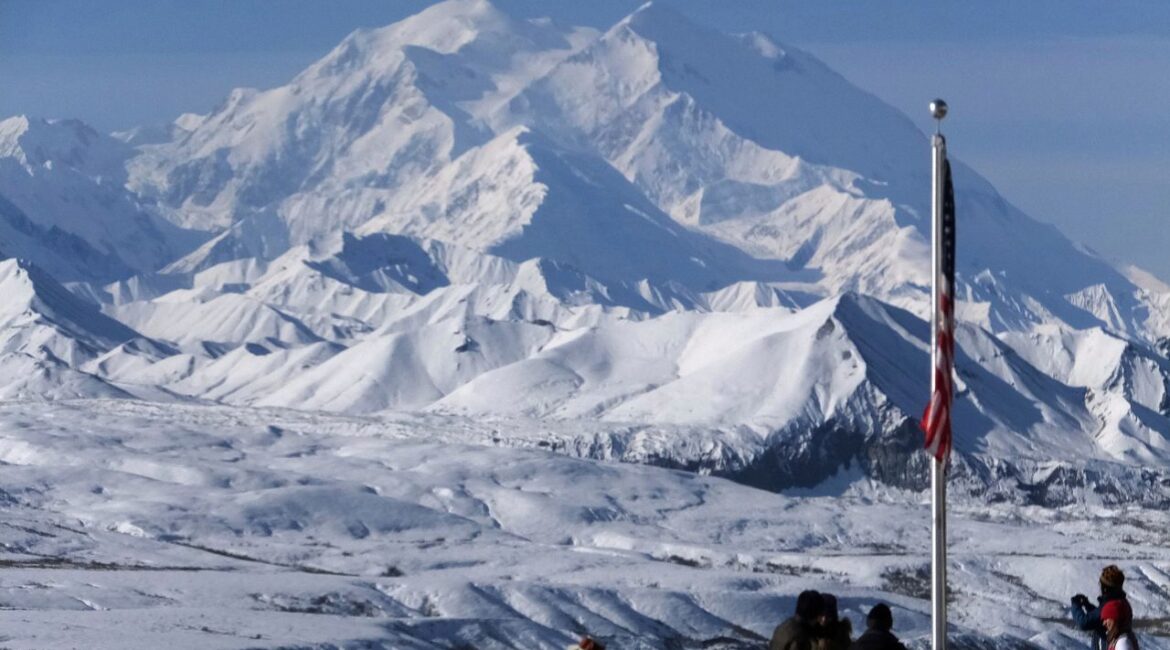 People stand at the Eielson Visitor Center with a view of North America's tallest peak, Denali, in the background, Sept. 2, 2015, in Denali National Park and Preserve, Alaska. (AP File)