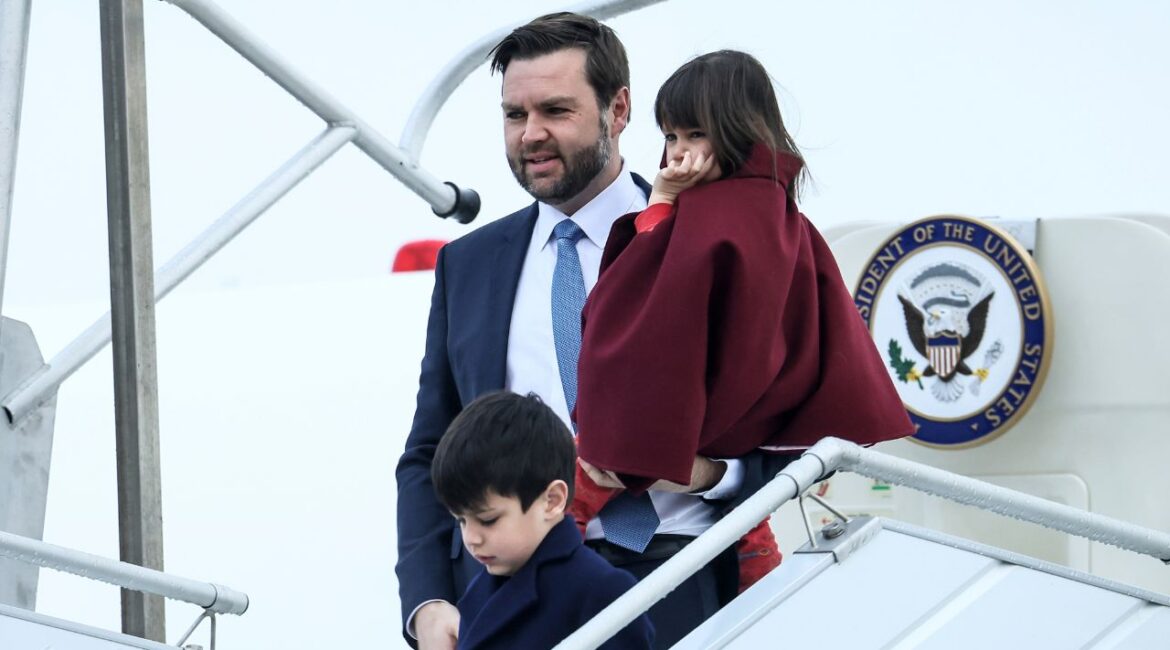 United States Vice-President JD Vance, center, carries his daughter Mirabel as he arrives at Paris Orly Airport, ahead of an Artificial Intelligence Action Summit taking place in Paris, Monday, Feb. 10, 2025. (AP/Thomas Padilla)