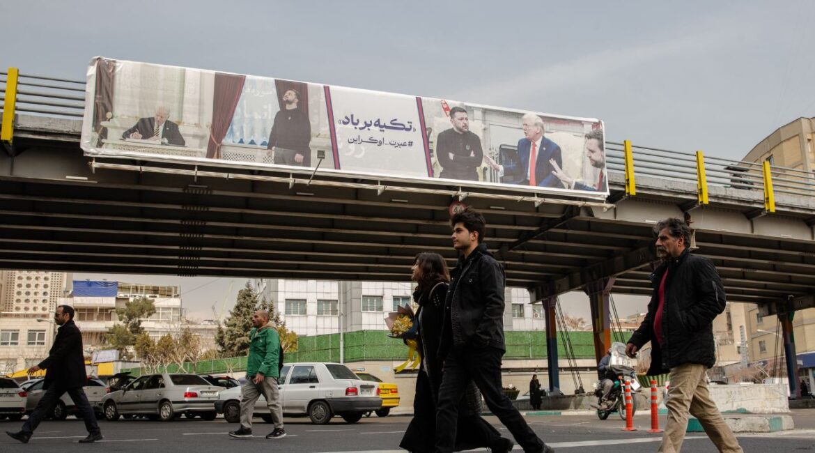 A banner showing pictures of President Volodymyr Zelenskyy of Ukraine’s visits to the White House, with a warning about trusting American diplomacy, in Tehran on Tuesday, March 4, 2025. President Donald Trump, who in 2018 withdrew the United States from a nuclear deal with Iran, claimed on March 7 that he had sent a letter to Ayatollah Ali Khamenei seeking to negotiate a new one. (Arash Khamooshi/The New York Times)