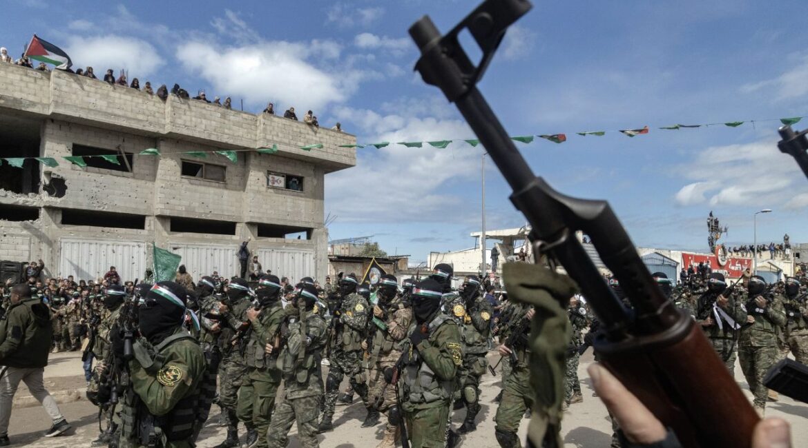 A show of force during a public hostage handover ceremony staged by Hamas in Nuseirat, in the central Gaza Strip, Feb. 22, 2025. U.S. and Hamas officials held talks in Qatar about hostages held in the Gaza Strip, breaking with a long-running American policy of refusing to directly engage with the militant group, according to an Israeli official and a diplomat briefed on the matter. (Saher Alghorra/The New York Times)