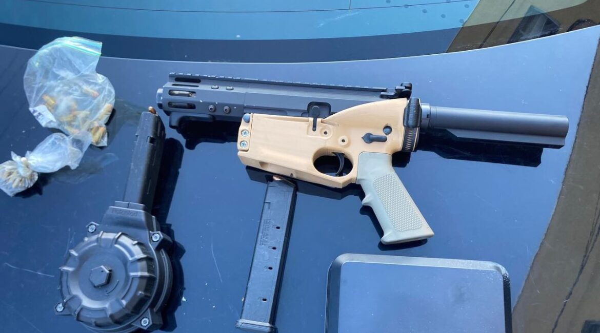 Amari Johnson, 20, was arrested after fleeing a traffic stop, leaving his 2-year-old son in the car, and hiding in an apartment where police found a loaded ghost AR-15 pistol. (Visalia PD)