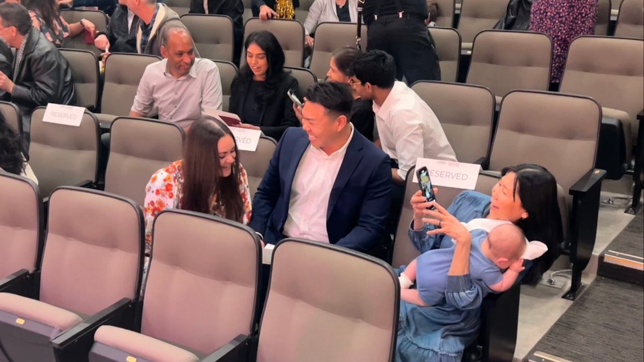 Dexter Tan (center) opens his envelope to see which residency he has been matched with on Friday, March 21, 2025. (GV WireAnthony W. Haddad)