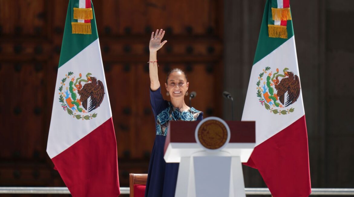 President Claudia Sheinbaum waves to supporters at a rally she convened to welcome U.S. President Donald Trump's decision to postpone tariffs on Mexican goods for one month at the Zocalo, Mexico City's main square, Sunday, March 9, 2025. (AP Photo/Eduardo Verdugo)