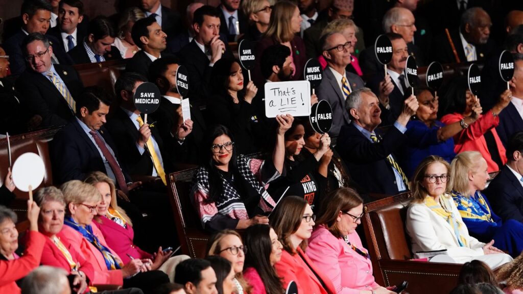 Rep. Rashida Tlaib (D-Mich.) holds up a “That’s a lie!” sign while protesting during President Donald Trump’s address to a joint session of Congress at the Capitol in Washington, on Tuesday, March 4, 2025. (Haiyun Jiang/The New York Times)