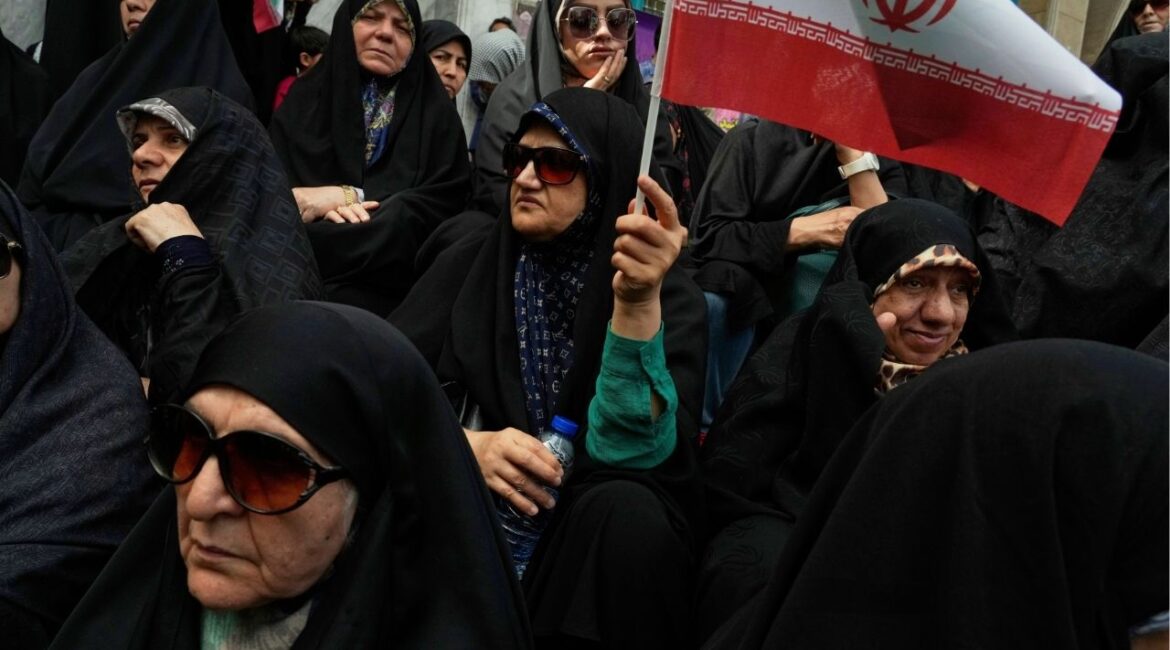 An Iranian protester waves her country's flag during an anti-Israeli demonstration at the Felestin (Palestine) Sq. in Tehran, Iran, Wednesday, April 9, 2025. (AP/Vahid Salemi)