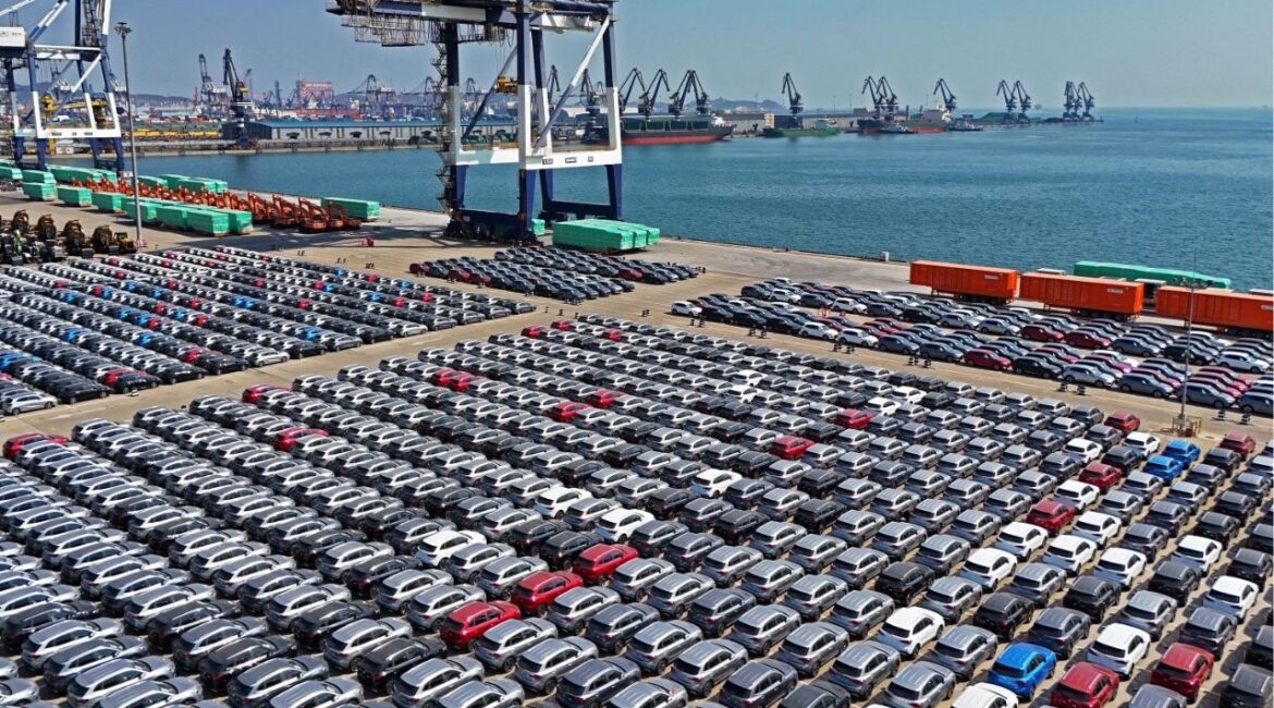 An aerial view of new cars waiting for shipment at a pier for ro-ro ships in Yantai city in eastern China's Shandong province Sunday, March 30, 2025. (Chinatopix Via AP)