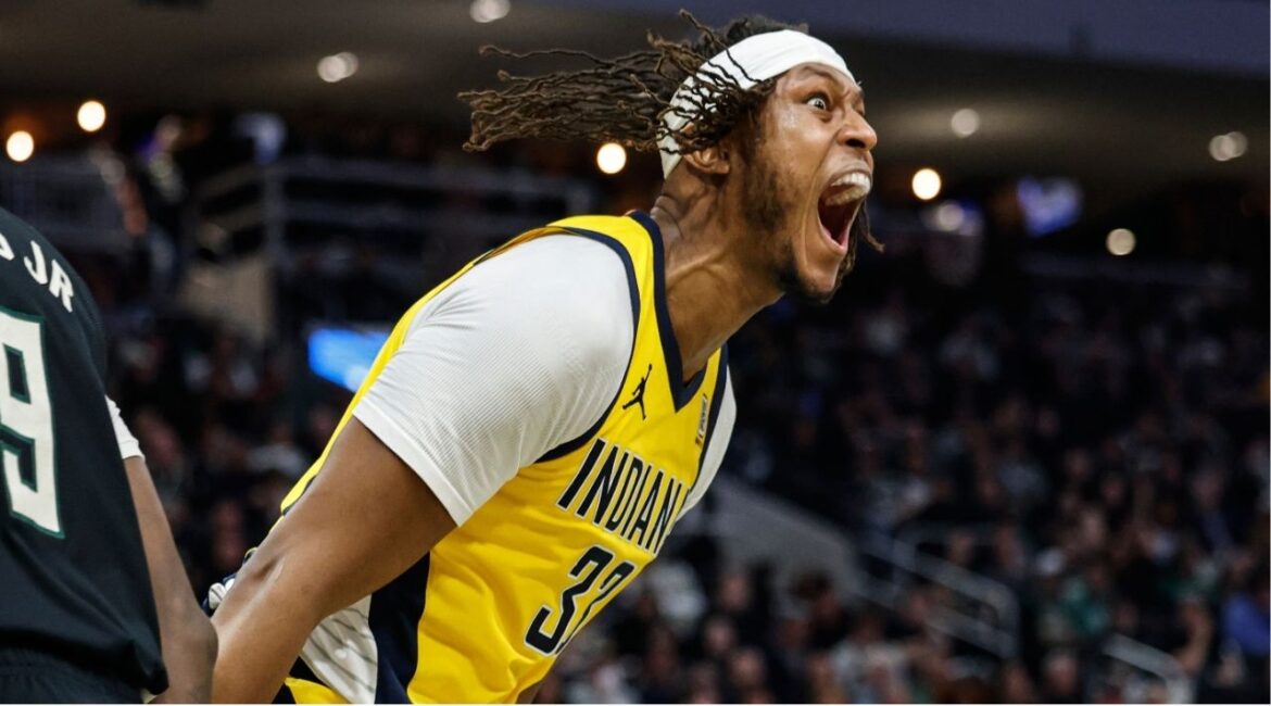 Indiana Pacers' Myles Turner (33) reacts after dunking over Milwaukee Bucks' Giannis Antetokounmpo during the second half of Game 4 of a first-round NBA basketball playoff series Sunday, April 27, 2025, in Milwaukee. (AP/Jeffrey Phelps)