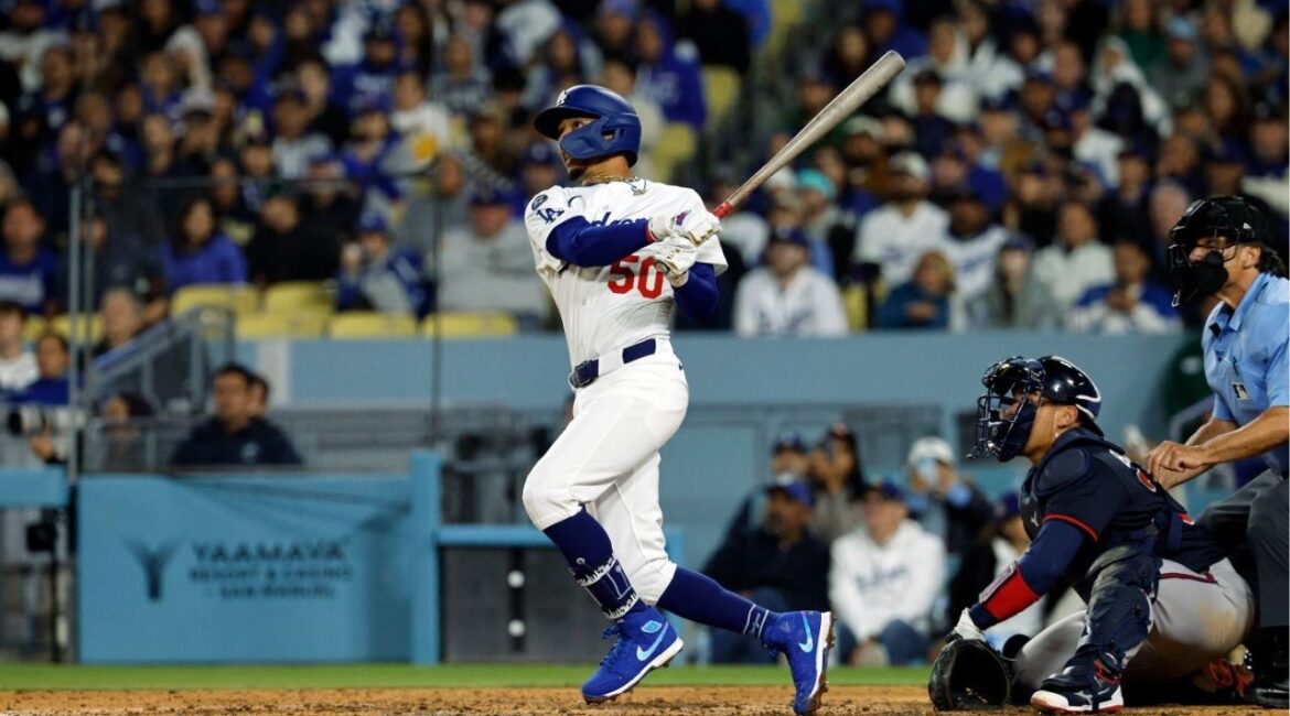 Los Angeles Dodgers' Mookie Betts hits a two-run home run against the Atlanta Braves during the sixth inning of a baseball game Tuesday, April 1, 2025, in, Los Angeles. (AP/Kevork Djansezian)
