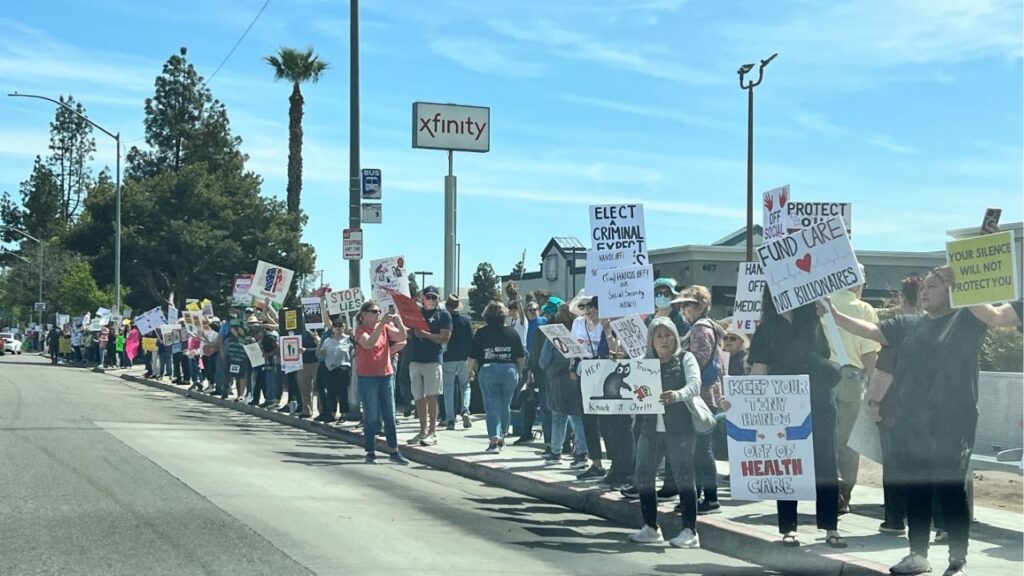 More than a thousand people gathered in Fresno on Saturday as part of a global “Hands Off!” protest against President Donald Trump, Elon Musk, and policies they say threaten critical social programs and civil rights. (GV Wire/Anthony W. Haddad)