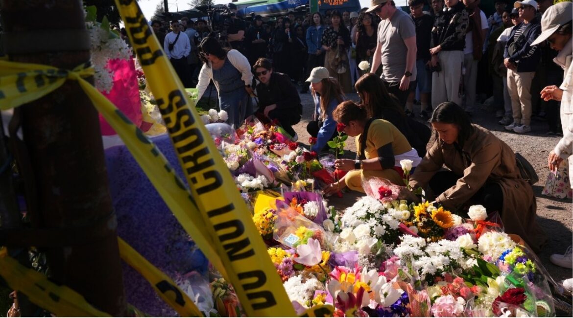 Visitors pay their respects at a memorial after a vehicle drove into a crowd during a Filipino heritage festival in Vancouver, British Columbia, Sunday, April 27, 2025. (AP/Lindsey Wasson)