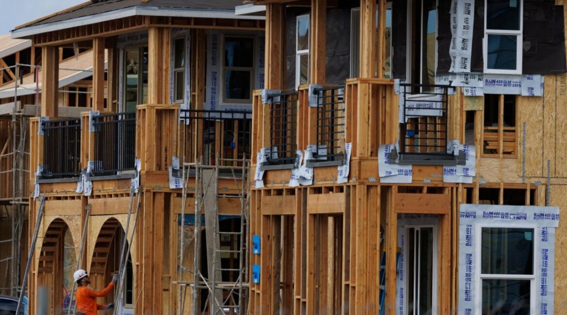 A construction worker helps build residential homes in Irvine, California, U.S., March 28, 2025. REUTERS/Mike Blake/File Photo