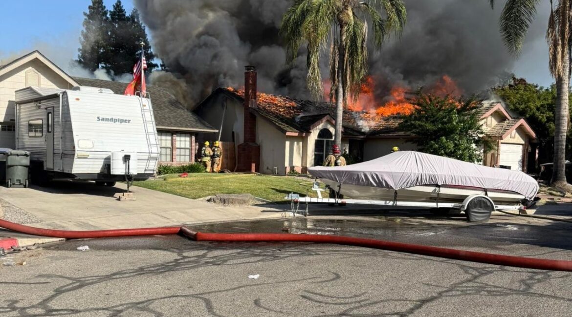 A house fire in Visalia Friday, May 30, 2025, prompted evacuations and road closures as emergency crews responded to the active scene. (GV Wire)