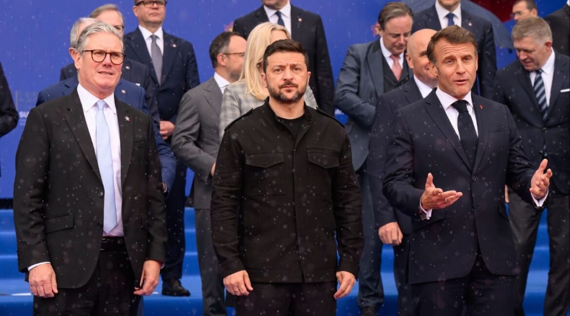 Britain's Prime Minister Keir Starmer, left, Ukraine's President Volodymyr Zelenskyy and France's President Emmanuel Macron, right, during a group photo at the beginning of a summit where the leaders of 47 European countries and organizations will discuss security, defense and democratic standards, in Tirana, Albania, Friday, May 16, 2025. (Leon Neal/Pool via AP)