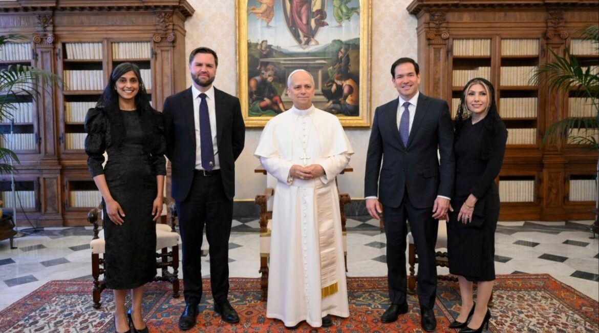 Pope Leo XIV stands for a family photo with Vice President JD Vance, second from left, his wife Usha Vance, Secretary of State Marco Rubio, second from right, and his wife Jeanette Dousdebes Rubio, on the occasion of their meeting at the Vatican, Monday, May 19, 2025. (Vatican Media via AP)