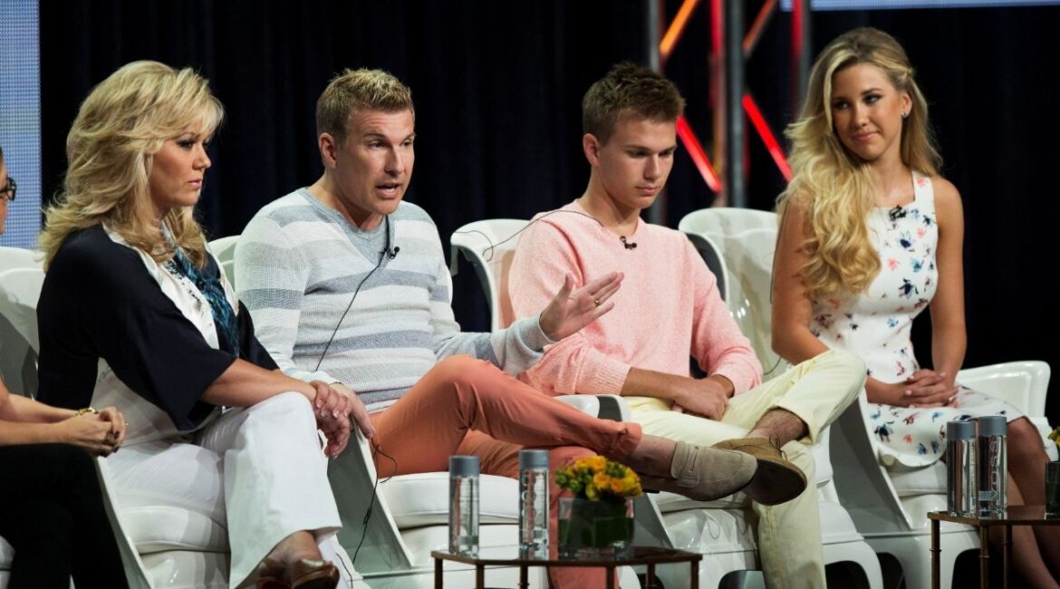 Todd Chrisley (2nd L) speaks next to his wife Julie (L) and their kids Chase and Savannah at a panel for the USA television series "Chrisley Knows Best" during the Television Critics Association Cable Summer Press Tour in Beverly Hills, California July 14, 2014. REUTERS/Mario Anzuoni/File Photo