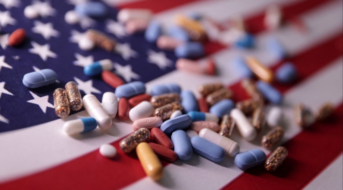 U.S. flag and medicines are seen in this illustration taken, June 27, 2024. REUTERS/Dado Ruvic/Illustration/File Photo