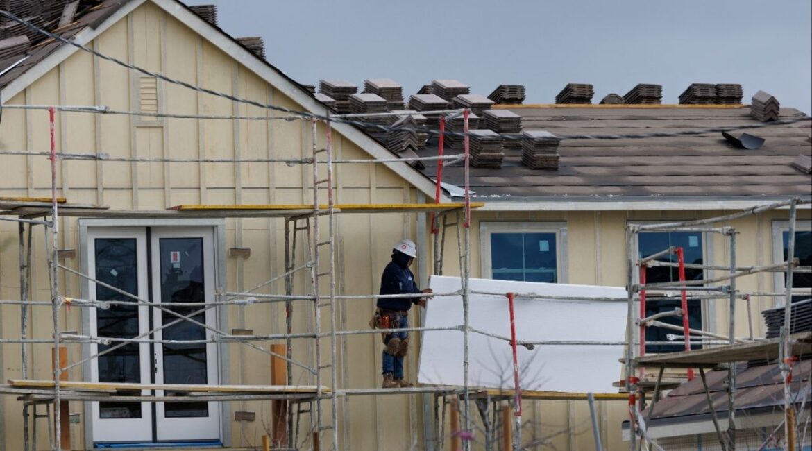 Workers construct a single family home at a Lennar housing development in San Diego, California, U.S., March 11, 2025. REUTERS/Mike Blake/File Photo