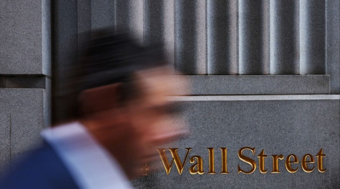 A man walks past a Wall Street marking outside the New York Stock Exchange (NYSE) building in New York City, U.S., March 11, 2025. (Reuters File)
