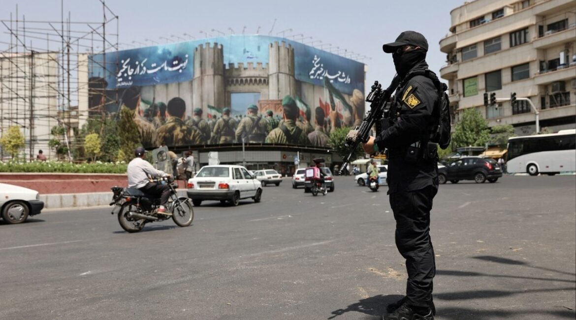 A security guard stands on a street, during early hours of ceasefire, in Tehran, Iran, June 24, 2025. Majid Asgaripour/WANA (West Asia News Agency) via REUTERS