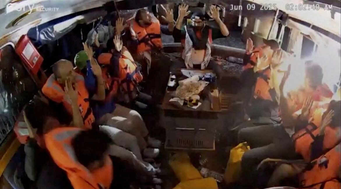 A surveillance footage shows crew of the Gaza-bound British-flagged yacht "Madleen", put their hands up as strong light came into the vessel, in this screengrab from a video released on June 9, 2025. Freedom Flotilla Coalition/Handout via REUTERS
