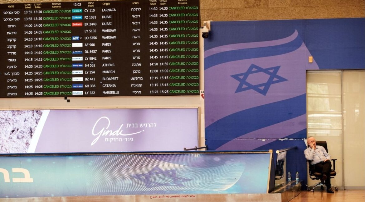 A worker sits at a terminal at Ben Gurion International Airport in Israel, June 13, 2025. (Reuters File)