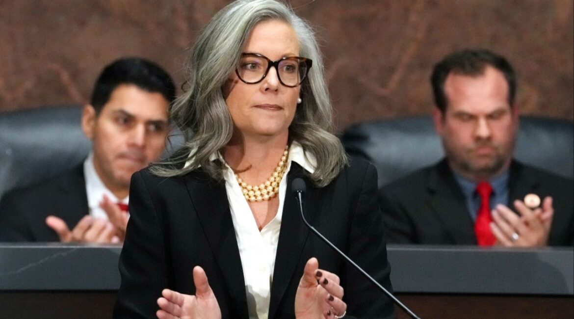Arizona Democratic Gov. Katie Hobbs, center, applauds for those affected by the Los Angeles area wildfires as she gives the State of the State address in the House of Representatives at the state Capitol with Speaker of the House Rep. Steve Montenegro, R-Litchfield Park, left, and Senate President Warren Petersen, R-Gilbert, flanking the governor on Jan. 13, 2025, in Phoenix. (AP File)