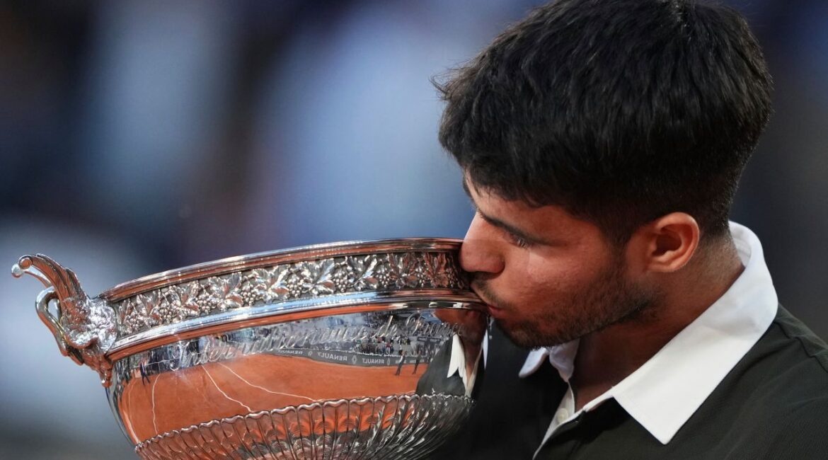 Alcaraz Kisses Trophy After Winning French Open