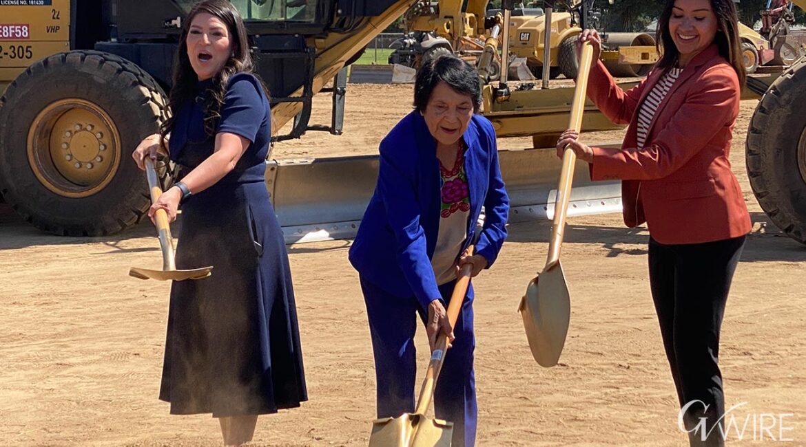 Image of Dolores Huerta shoveling dirt