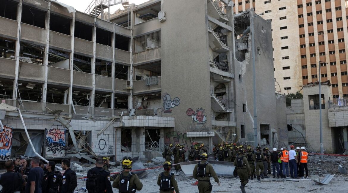 Emergency personnel work at an impact site following Iran's missile strike on Israel, amid the Iran-Israel conflict, in Haifa, Israel, June 20, 2025. (Reuters File)