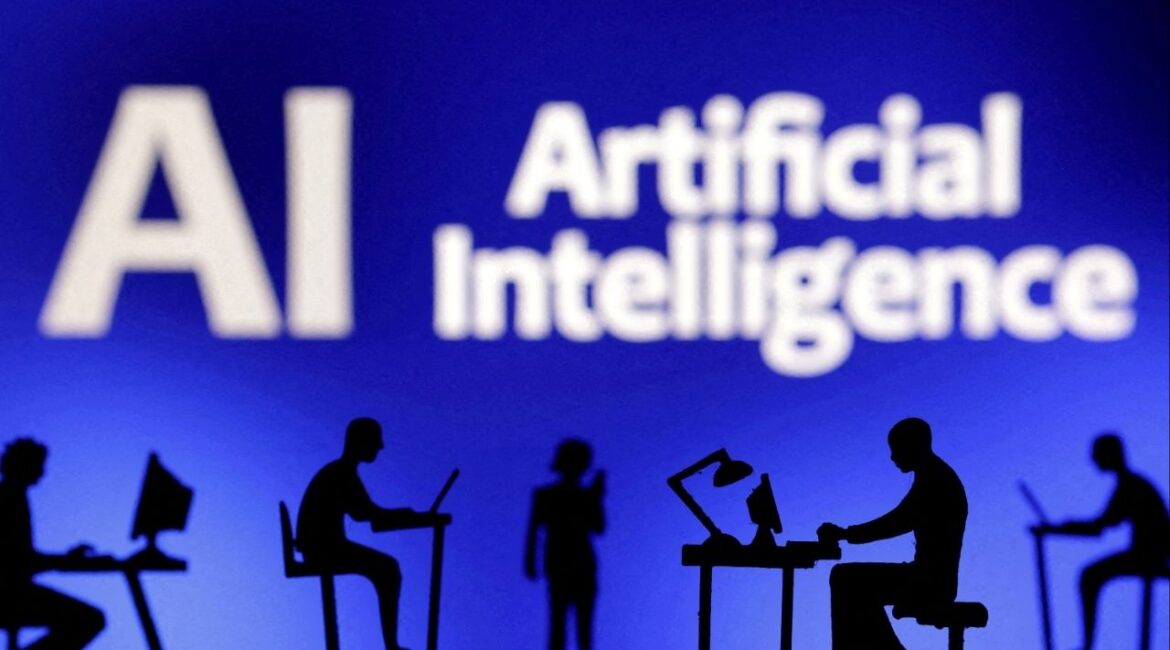 Figurines with computers and smartphones are seen in front of the words "Artificial Intelligence AI" in this illustration taken, February 19, 2024. (Reuters File)