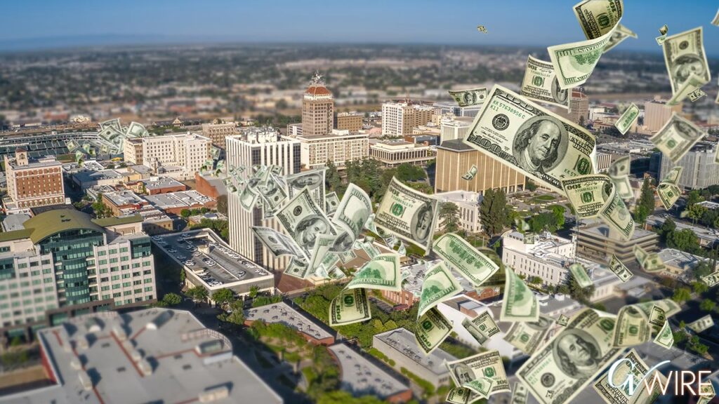 Composite image of $100 bills floating through the air of downtown Fresno