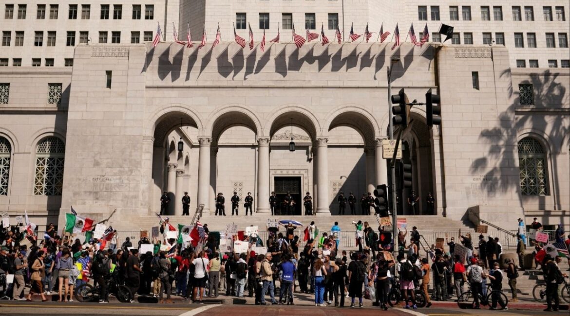 Law enforcement officers guard Los Angeles City Hall during a protest against federal immigration sweeps, in Los Angeles, California, U.S. June 12, 2025. (Reuters/David Ryder)