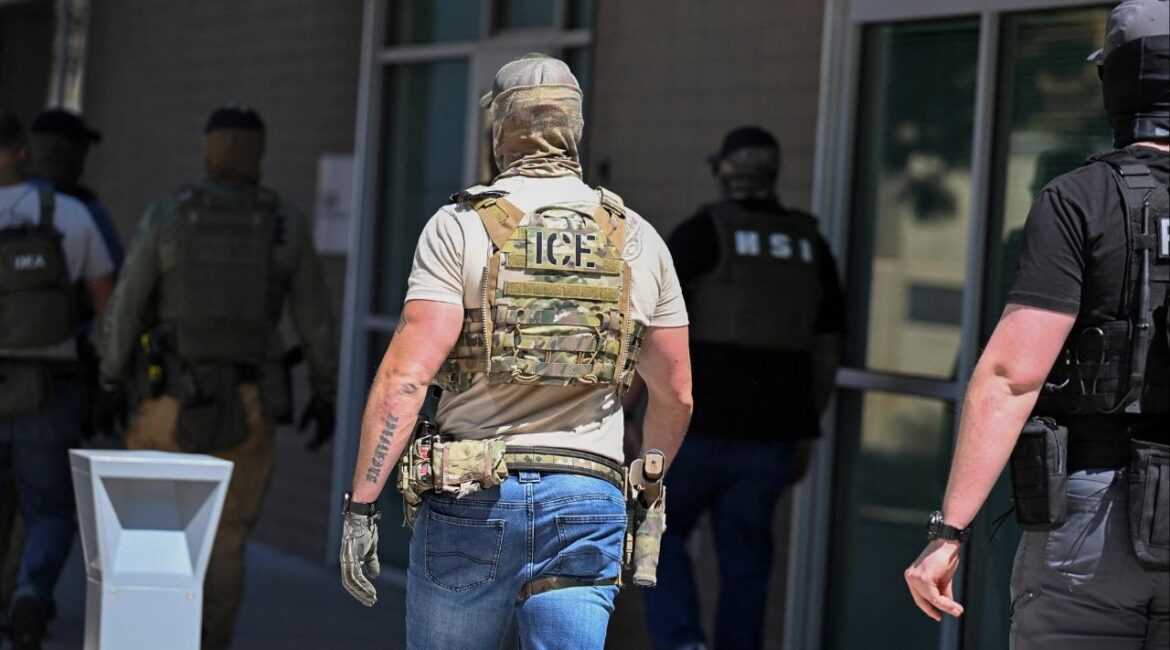Masked law enforcement officers, including HSI and ICE agents, walk into an immigration court in Phoenix, Arizona, U.S., May 21, 2025. (Reuters File)