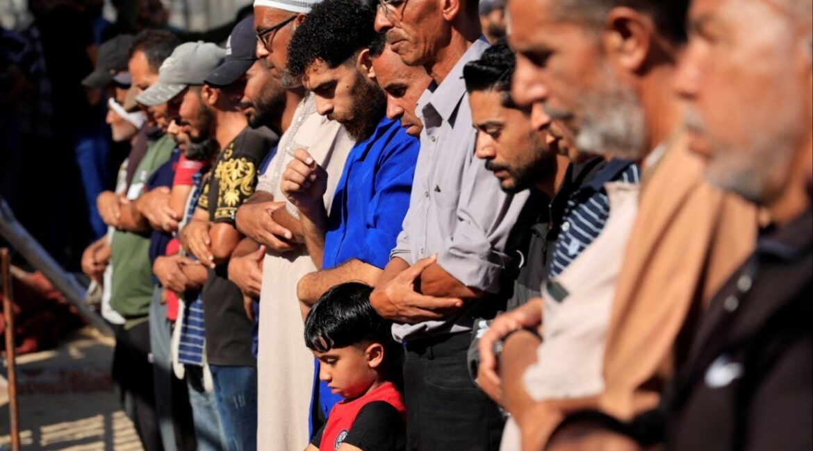 Mourners pray as they attend the funeral of Palestinians killed, in what the Gaza Health Ministry said, were overnight Israeli airstrikes on tents sheltering displaced people, at Nasser hospital, in Khan Younis, southern Gaza Strip, June 26, 2025. (Reuters/Hatem Khaled)