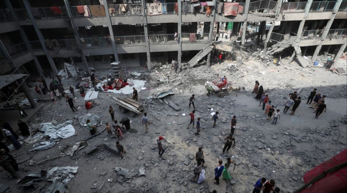 Palestinians inspect the damage at an UNRWA school sheltering displaced people that was hit in an Israeli air strike on Sunday, in Gaza City, June 30, 2025. (Reuters/Mahmoud Issa)