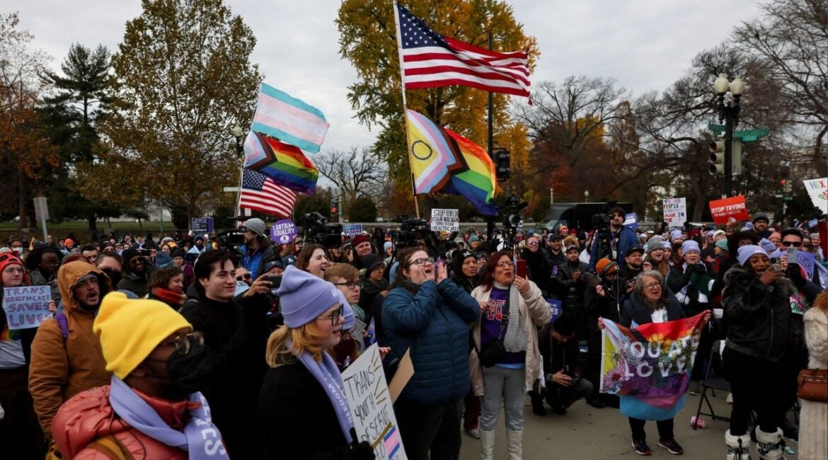 People gather and react outside the U.S. Supreme Court on the day it heard arguments over an appeal by U.S. President Joe Biden's administration of a lower court's decision upholding a Republican-backed ban in Tennessee on gender-affirming medical care for transgender minors, in Washington, U.S., December 4, 2024. (Reuters File)