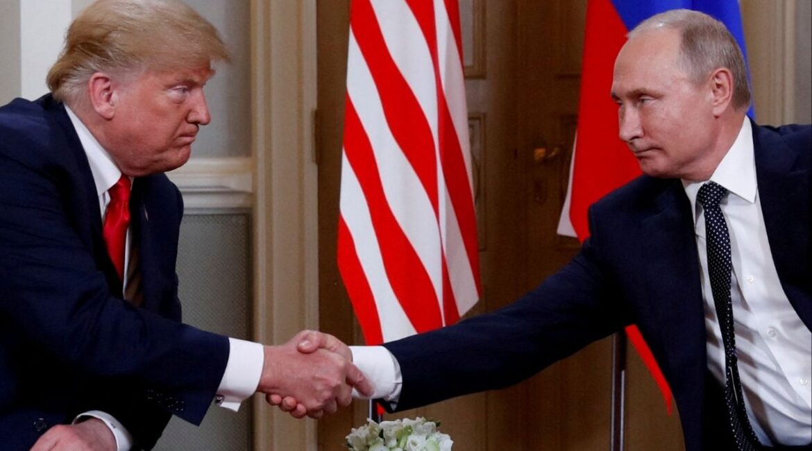 President Donald Trump and Russia's President Vladimir Putin shake hands as they meet in Helsinki, Finland July 16, 2018. REUTERS/Kevin Lamarque/File Photo