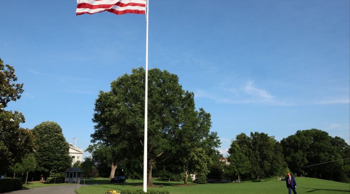 President Donald Trump gestures next to a new flagpole with the U.S. flag after disembarking Marine One upon arrival at the White House in Washington, D.C., U.S., June 21, 2025. (Reuters/Kevin Mohatt)